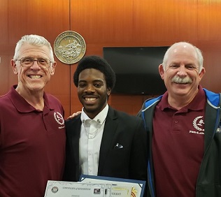 graduating student with 2 professors