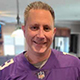 David Adams smiling in a purple Vikings jersey.