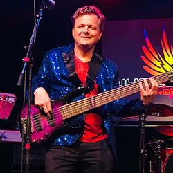 Jeff Bretz playing a purple six-string bass