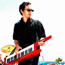 Jonathan Lacroix playing a red keytar