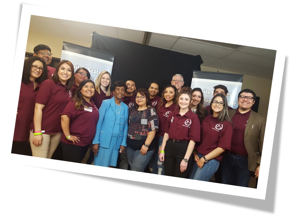 group of student posing with federal judge