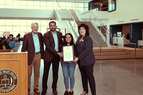 Antelope Valley College Superintendent/President Jennifer Zellet (right), accepts a proclamation during the Grand Opening of the new Student Services building. 