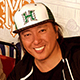Luis Ramirez smiling, wearing a University of Hawaii Rainbow Warriors baseball hat.