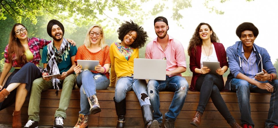 Students sitting on wall