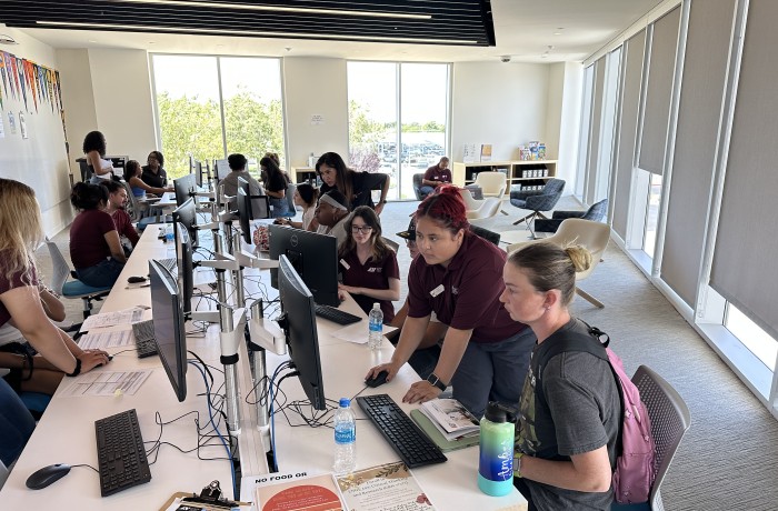 Antelope Valley College staff assist students with registration. 