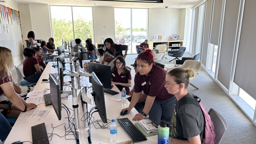 Antelope Valley College staff assist students with registration. 