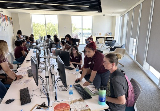 Antelope Valley College staff assist students with registration. 