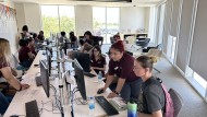 Antelope Valley College staff assist students with registration. 
