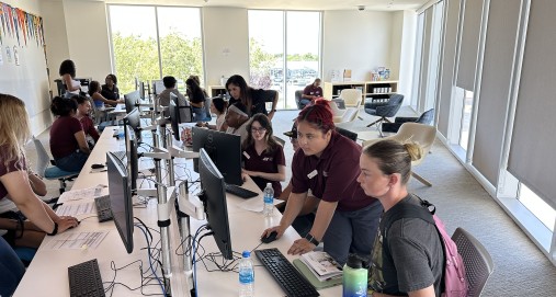 Antelope Valley College staff assist students with registration. 